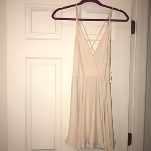 ivory Urban Outfitters plunge neck babydoll dress
